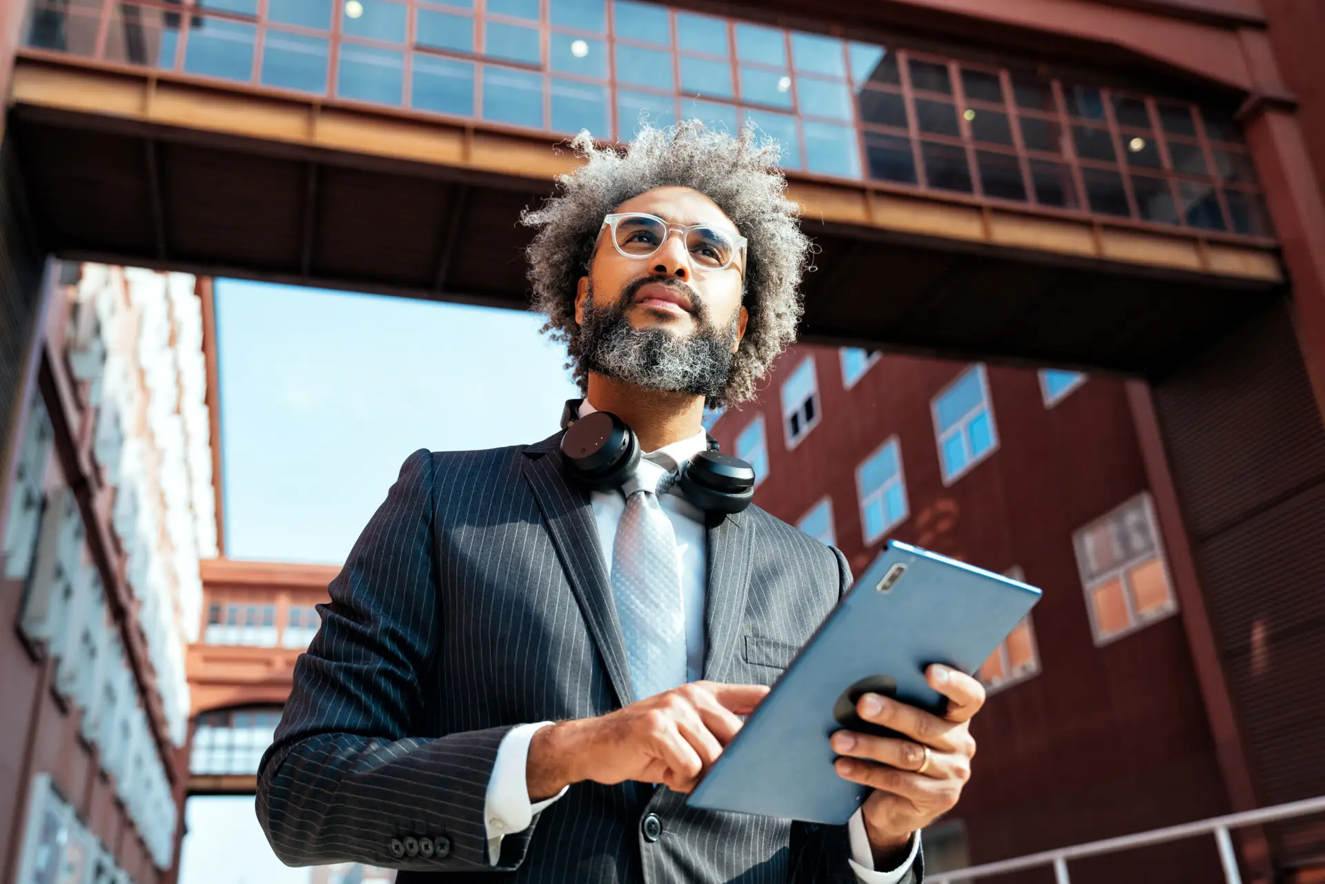 An entrepreneur working outdoors with a tablet